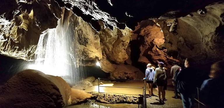 Group viewing a waterfall in Tuckaleechee Taverns, one of the more popular things to do in Townsend, TN
