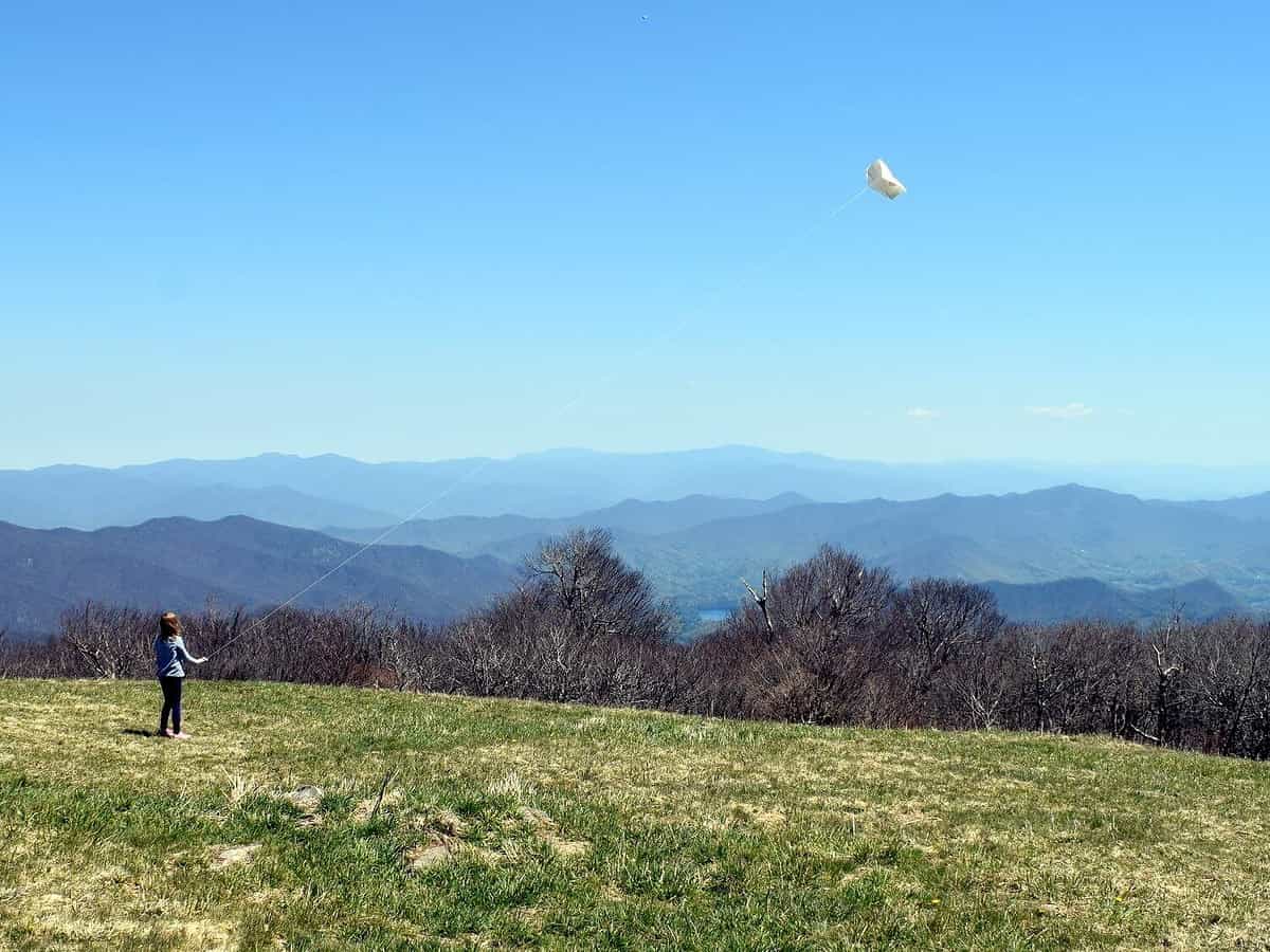 Girl flying kite on Huckleberry Knob on the Cherohala Skyway